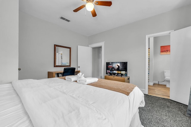 bedroom featuring visible vents, ensuite bath, and a ceiling fan