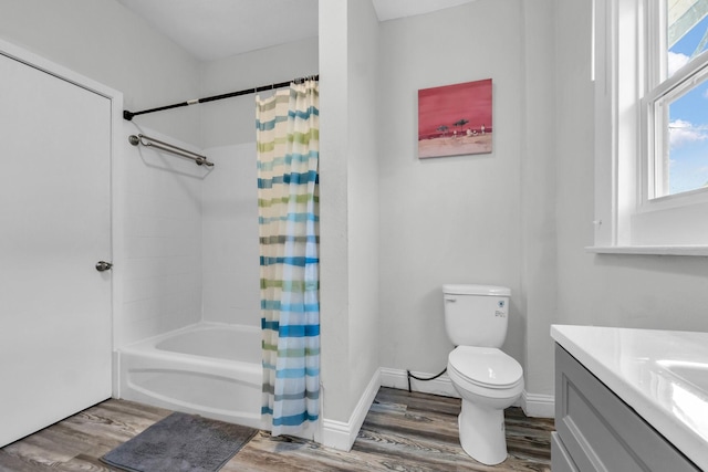 full bath with vanity, shower / bath combination with curtain, toilet, and wood finished floors