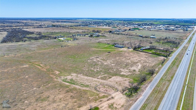 birds eye view of property featuring a rural view