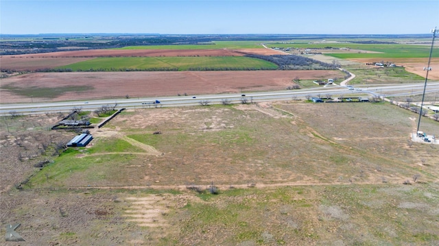 birds eye view of property featuring a rural view