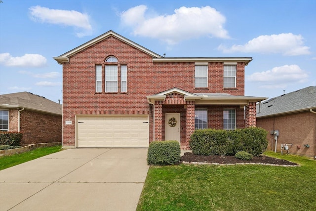 traditional home with brick siding, an attached garage, concrete driveway, and a front yard