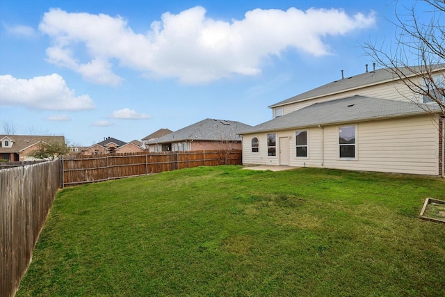 view of yard with a patio and a fenced backyard