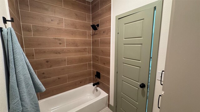 bathroom featuring wooden walls and shower / washtub combination