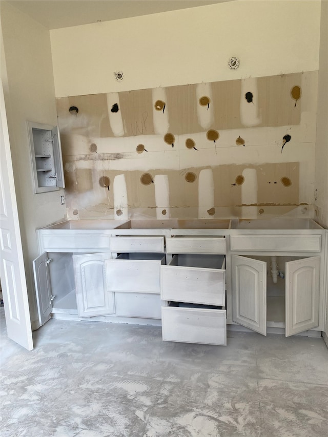 bathroom with concrete floors