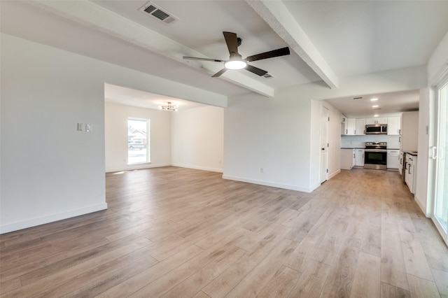 unfurnished living room with light wood finished floors, visible vents, baseboards, beam ceiling, and ceiling fan with notable chandelier