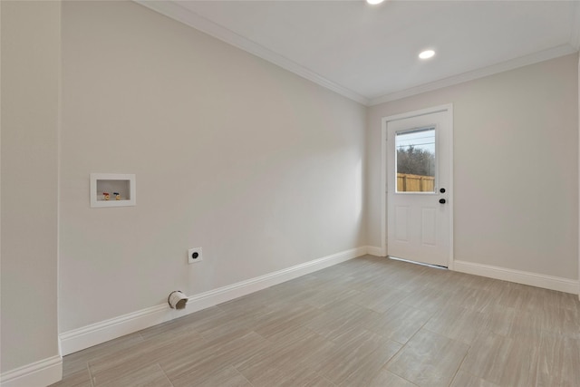 laundry area featuring ornamental molding, electric dryer hookup, baseboards, and washer hookup