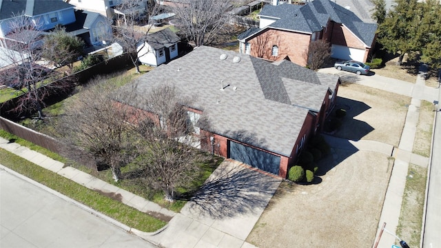 birds eye view of property with a residential view