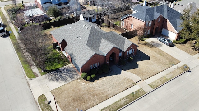 birds eye view of property with a residential view