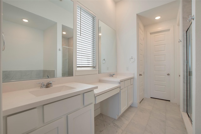 full bath featuring two vanities, recessed lighting, a stall shower, a sink, and marble finish floor