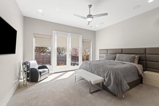 bedroom featuring visible vents, multiple windows, carpet flooring, and access to outside