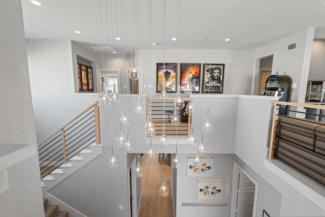 interior space featuring recessed lighting and a towering ceiling