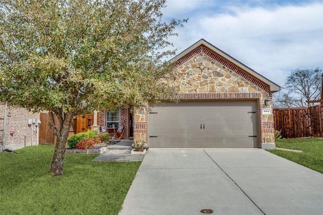 view of front facade with fence, driveway, a garage, stone siding, and brick siding