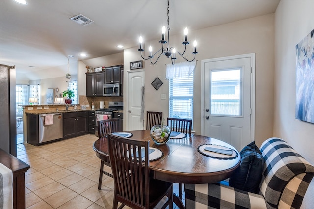 dining room featuring light tile patterned floors, visible vents, and recessed lighting