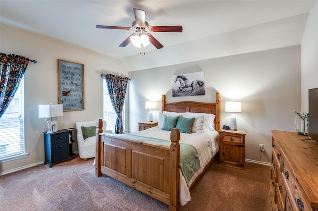 carpeted bedroom featuring vaulted ceiling, a ceiling fan, and baseboards