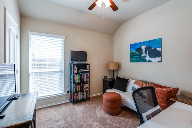 office space featuring ceiling fan, baseboards, carpet, and vaulted ceiling