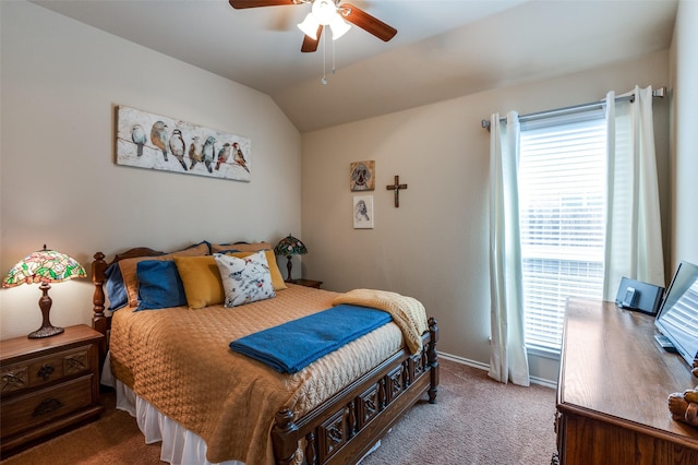 bedroom featuring carpet flooring, multiple windows, baseboards, and vaulted ceiling