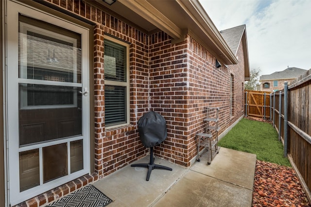 view of patio featuring a fenced backyard and a grill