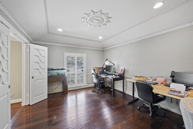 office space with a tray ceiling, recessed lighting, wood finished floors, and ornamental molding