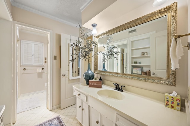 bathroom with visible vents, toilet, ornamental molding, a textured ceiling, and vanity