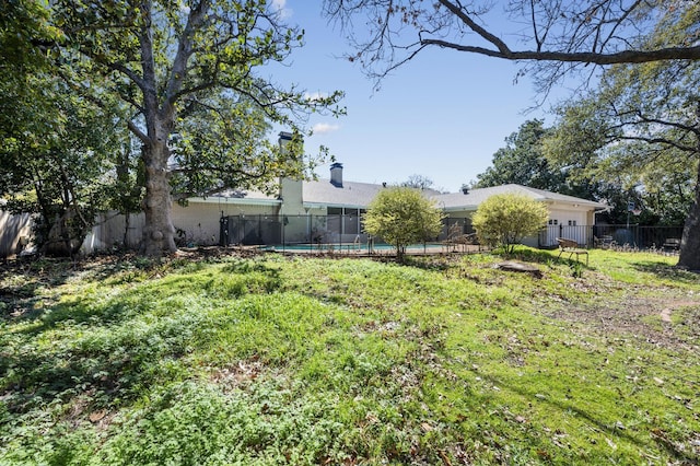 view of yard with a fenced in pool and a fenced backyard