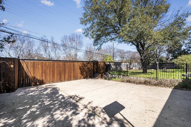 view of patio featuring fence