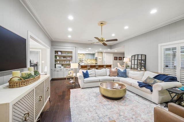 living room with recessed lighting, ornamental molding, dark wood finished floors, and ceiling fan