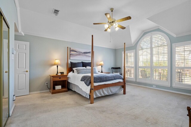 carpeted bedroom with visible vents, crown molding, baseboards, lofted ceiling, and a ceiling fan