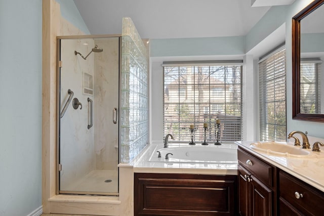 bathroom with vanity, a bath, and a stall shower