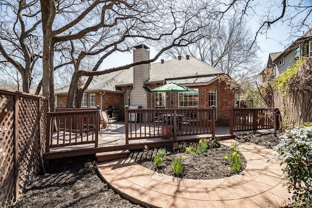 wooden deck with area for grilling