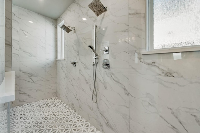 full bath featuring a marble finish shower