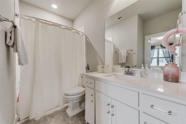 bathroom with visible vents, toilet, vanity, and a shower with curtain