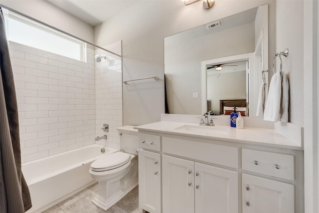 full bath featuring vanity, visible vents, tile patterned flooring, shower / bath combo with shower curtain, and toilet