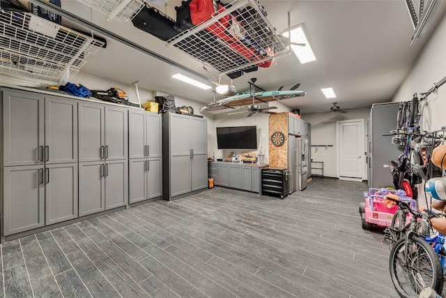 garage featuring high quality fridge and ceiling fan