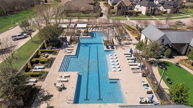 view of swimming pool with a residential view