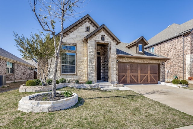 view of front of house featuring a front lawn, stone siding, roof with shingles, concrete driveway, and brick siding