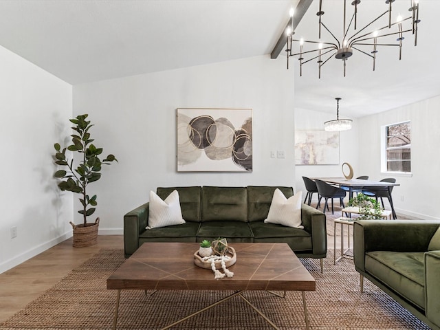 living room featuring an inviting chandelier, vaulted ceiling with beams, wood finished floors, and baseboards