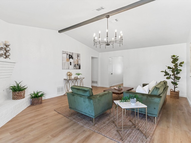 living area featuring lofted ceiling with beams, wood finished floors, visible vents, and a chandelier