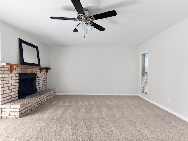 unfurnished living room featuring a fireplace, a ceiling fan, baseboards, and carpet floors