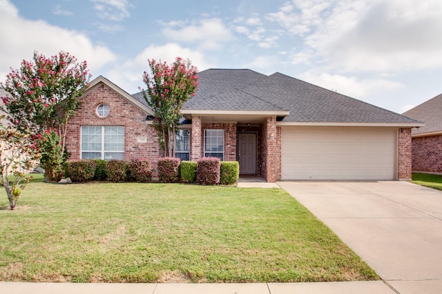 single story home featuring roof with shingles, concrete driveway, a front lawn, a garage, and brick siding