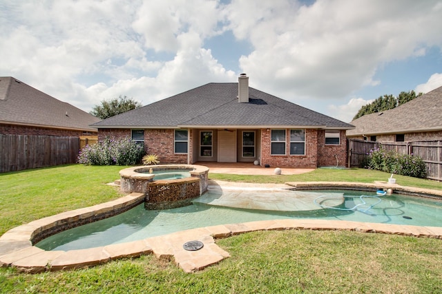 view of pool featuring an in ground hot tub, a yard, a fenced in pool, and a fenced backyard