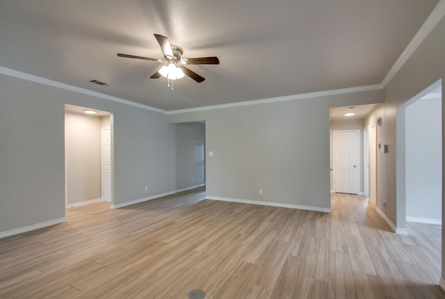 empty room with visible vents, baseboards, and light wood-style floors