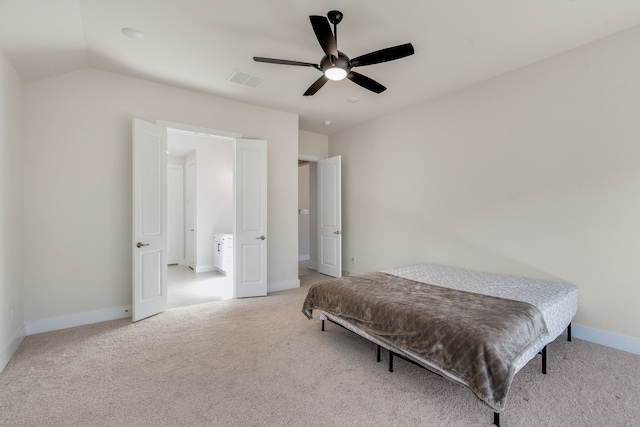 bedroom featuring visible vents, baseboards, light colored carpet, lofted ceiling, and a ceiling fan