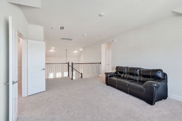 living area with carpet flooring and visible vents