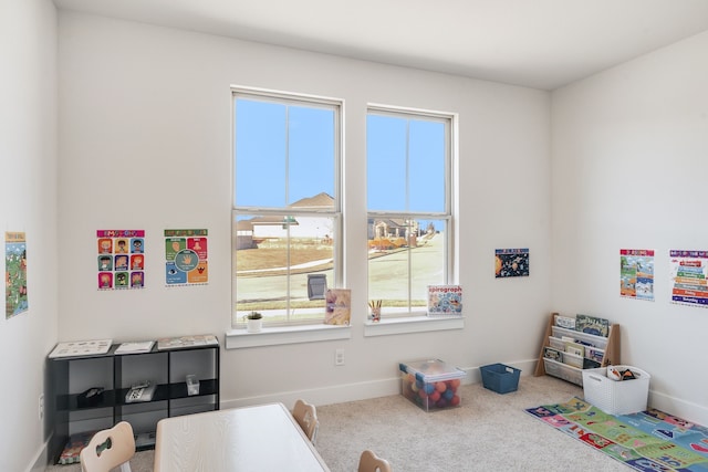 game room featuring baseboards and carpet