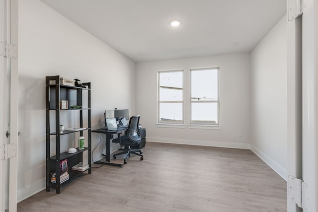 office space featuring light wood-style flooring and baseboards