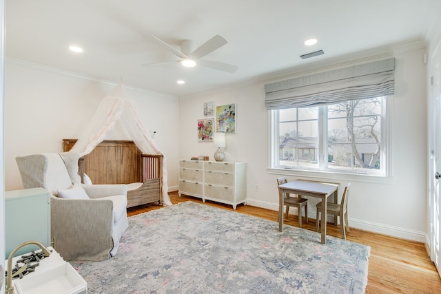 bedroom featuring visible vents, baseboards, ornamental molding, recessed lighting, and wood finished floors