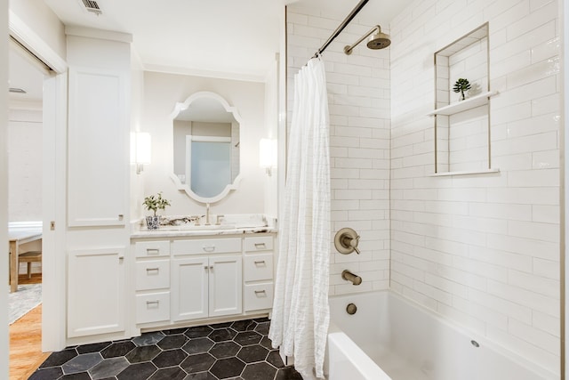 bathroom featuring vanity, shower / tub combo, and crown molding