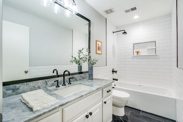 full bathroom featuring vanity, toilet, bathtub / shower combination, and visible vents