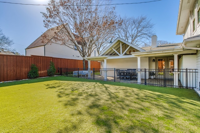 view of yard with a fenced backyard