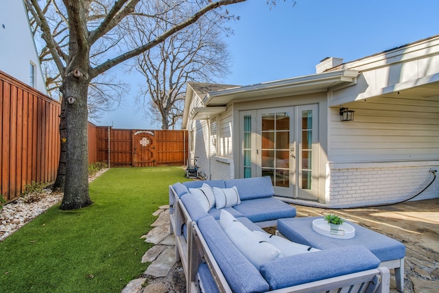 exterior space featuring french doors, outdoor lounge area, a fenced backyard, and a gate